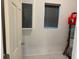 Utility closet featuring electrical panel and window at 708 E Broadway St, Fort Meade, FL 33841