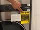 Close-up of EnergyGuide label on washer/dryer unit at 708 E Broadway St, Fort Meade, FL 33841