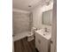 Updated bathroom featuring modern vanity, new fixtures, and a tiled shower at 847 Kristen Ct, Bartow, FL 33830