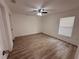 Bedroom features neutral walls, ample natural light, and a ceiling fan for comfort at 847 Kristen Ct, Bartow, FL 33830