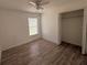 Cozy bedroom with a ceiling fan, closet, and a window offering plenty of natural light at 847 Kristen Ct, Bartow, FL 33830
