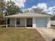 Charming single-story home featuring a one-car garage, covered porch, and freshly painted exterior at 847 Kristen Ct, Bartow, FL 33830