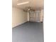 Clean and functional garage with a modern garage door and ample space for parking vehicles at 847 Kristen Ct, Bartow, FL 33830