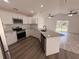 Modern kitchen featuring white cabinets, stainless steel appliances, and granite countertops at 847 Kristen Ct, Bartow, FL 33830