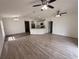 Spacious living room has lots of natural light and features modern ceiling fans and an open concept design at 847 Kristen Ct, Bartow, FL 33830