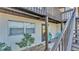 Exterior of a townhome with a private entrance, window, and decorative landscaping at 900 Avenue Z Se # A3, Winter Haven, FL 33880