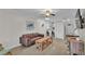 Comfortable living area with tile flooring, ceiling fan and stylish decor at 900 Avenue Z Se # A3, Winter Haven, FL 33880
