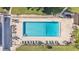 Aerial view of community pool featuring ample seating and well-maintained surroundings at 900 Avenue Z Se # A3, Winter Haven, FL 33880