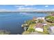 Waterfront view of a lake with a wooden dock, with lush greenery surrounding at 900 Avenue Z Se # A3, Winter Haven, FL 33880