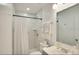 This bathroom has a white marble shower, toilet and sink at 919 Avenue S Se, Winter Haven, FL 33880