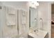 Bright bathroom featuring fresh towels, modern vanity, and a well-lit mirror at 919 Avenue S Se, Winter Haven, FL 33880