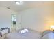 Comfortable bed in a bedroom featuring an open doorway leading to another room and a closet at 919 Avenue S Se, Winter Haven, FL 33880