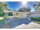 Inviting single-story home featuring a spacious carport and well-maintained landscaping at 919 Avenue S Se, Winter Haven, FL 33880