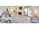 Bright and spacious living room with hardwood floors and sliding glass doors to the outdoor area at 919 Avenue S Se, Winter Haven, FL 33880