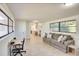 Open concept living area featuring a large couch, office area, and an abundance of natural light at 919 Avenue S Se, Winter Haven, FL 33880