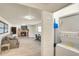 Bright living room with comfortable seating, fireplace, and laundry area with washer and dryer at 919 Avenue S Se, Winter Haven, FL 33880