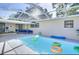 Sparkling screened-in pool area, perfect for relaxation and recreation, and featuring ample seating at 919 Avenue S Se, Winter Haven, FL 33880