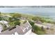 Aerial view showing a lake and the top of the house with dormers and chimneys at 926 S Lakeshore Blvd, Lake Wales, FL 33853