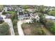 Aerial view of the home showing the driveway, large yard, and surrounding neighborhood at 926 S Lakeshore Blvd, Lake Wales, FL 33853