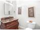 Chic powder room boasts a dark wood vanity with a marble countertop at 926 S Lakeshore Blvd, Lake Wales, FL 33853