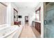Large bathroom showcases double vanity, walk-in shower, jacuzzi tub, and tiled floor at 926 S Lakeshore Blvd, Lake Wales, FL 33853