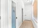 Hallway featuring a glass-paneled pantry door and tile flooring at 926 S Lakeshore Blvd, Lake Wales, FL 33853