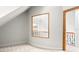 Hallway area featuring neutral walls, carpet, and wood railing at 926 S Lakeshore Blvd, Lake Wales, FL 33853