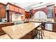 Gourmet kitchen featuring high-end appliances, custom cabinetry and tile backsplash at 926 S Lakeshore Blvd, Lake Wales, FL 33853