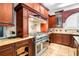 Gourmet kitchen featuring high-end appliances, custom cabinetry and tile backsplash at 926 S Lakeshore Blvd, Lake Wales, FL 33853