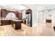 Spacious kitchen featuring custom cabinetry, stainless steel appliances, and a center island at 926 S Lakeshore Blvd, Lake Wales, FL 33853