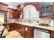 Gourmet kitchen featuring custom cabinetry, stainless steel appliances, and granite countertops at 926 S Lakeshore Blvd, Lake Wales, FL 33853