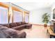 Living room with large sectional couch and big windows at 926 S Lakeshore Blvd, Lake Wales, FL 33853