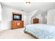 Bright main bedroom features a dresser, television, and carpeted floors at 926 S Lakeshore Blvd, Lake Wales, FL 33853
