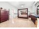 Spacious main bedroom features tile flooring, a ceiling fan, and a large wardrobe at 926 S Lakeshore Blvd, Lake Wales, FL 33853