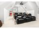 Home theater with projector screen, projector, and tiered seating at 926 S Lakeshore Blvd, Lake Wales, FL 33853