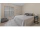 Comfortable bedroom with soft light, tile floors, large window, and plush accents at 991 Old Scenic Hwy, Lake Wales, FL 33853