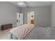 Spacious bedroom with neutral tones, tile flooring, and an ensuite bathroom at 991 Old Scenic Hwy, Lake Wales, FL 33853