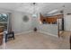 Open-concept dining area with a large window providing natural light and access to the kitchen at 991 Old Scenic Hwy, Lake Wales, FL 33853