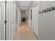 Hallway with tile flooring, white doors, and neutral wall paint at 991 Old Scenic Hwy, Lake Wales, FL 33853