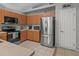 Bright kitchen featuring stainless steel appliances, light countertops, and wood cabinets at 991 Old Scenic Hwy, Lake Wales, FL 33853