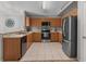 Spacious kitchen featuring stainless steel appliances, light countertops, and wood cabinets at 991 Old Scenic Hwy, Lake Wales, FL 33853