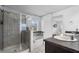 Bathroom featuring a glass enclosed shower, soaking tub and double sink vanity at 10234 Lenox St, Clermont, FL 34711