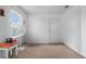 Bedroom featuring a ceiling fan, carpet, fan and exercise equipment at 10234 Lenox St, Clermont, FL 34711