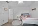 Cozy bedroom with carpet, queen bed, bedside table, and a plush white rug at 10234 Lenox St, Clermont, FL 34711