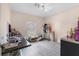 Bright bedroom with wood floors, large window, and functional desk area at 10234 Lenox St, Clermont, FL 34711