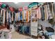Walk-in closet offering ample storage with shelving, hanging rods, and organized clothing and accessories at 10234 Lenox St, Clermont, FL 34711