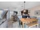 Dining area near stairs, kitchen, and living room provides a bright and open space at 10234 Lenox St, Clermont, FL 34711