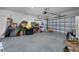 Spacious garage with ample room for parking and storage and overhead lighting at 10234 Lenox St, Clermont, FL 34711