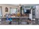 Kitchen sink featuring granite countertops, stainless steel fixtures, and an eat-in bar area at 10234 Lenox St, Clermont, FL 34711