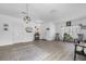 Spacious living room boasts modern floors, ample natural light, and cozy seating at 10234 Lenox St, Clermont, FL 34711